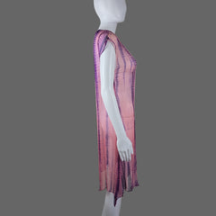 Mannequin draped with a pink and purple striped fabric against a plain background