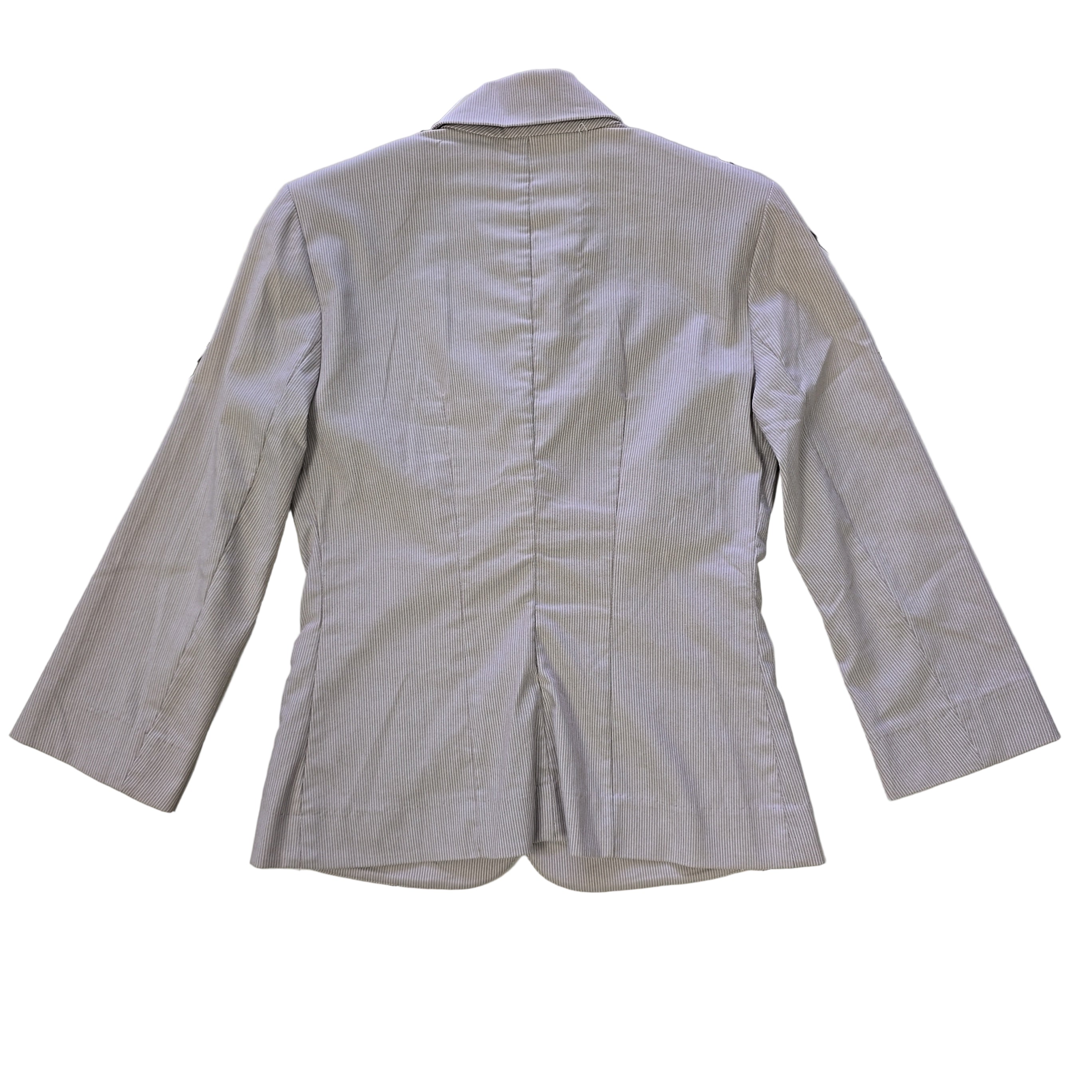 Light gray jacket on a tiled floor