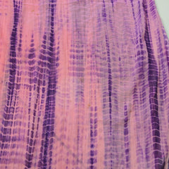Close-up of a textured fabric with purple and pink hues