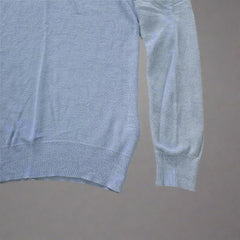 Folded blue fabric on a tiled floor