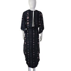 Black patterned fabric on a mannequin against a white background