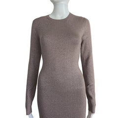 Plum coloured dress with silver details on a light background