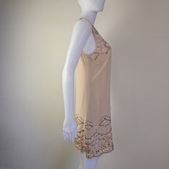 Mannequin wearing a beige dress on a light background
