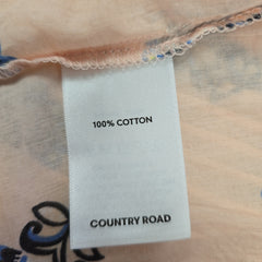 Label on fabric indicating 100% cotton and 'Country Road' brand.