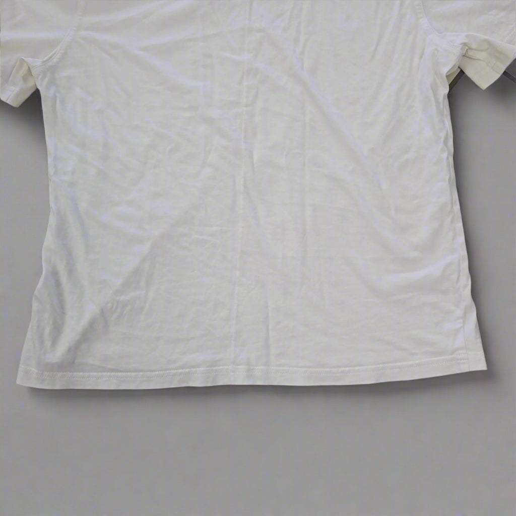 White t-shirt on a tiled floor
