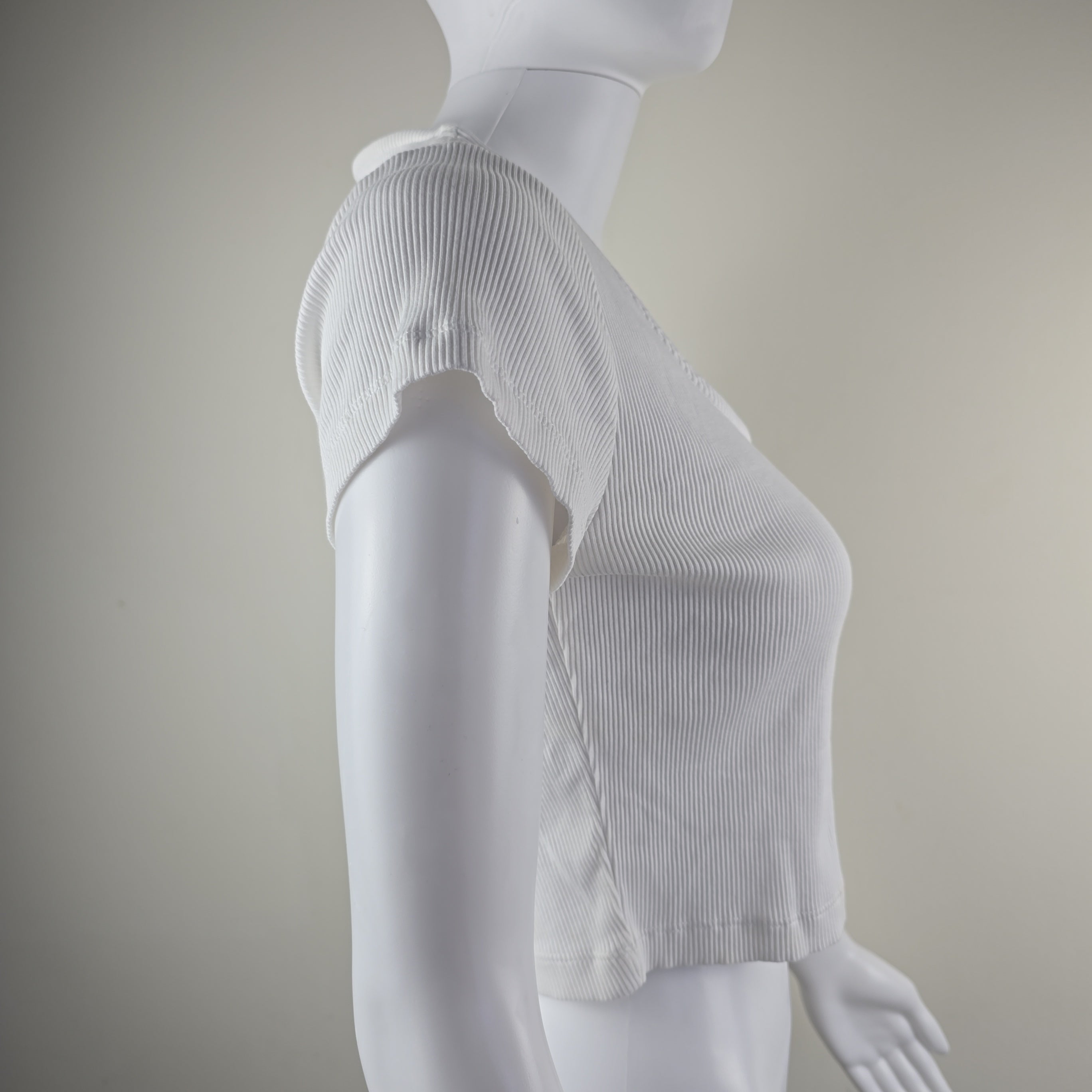 White pleated fabric on a neutral background