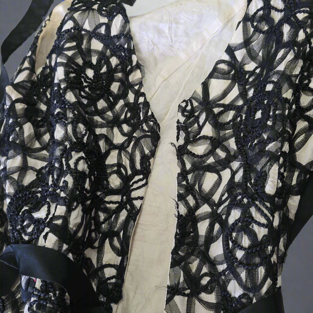 Black lace fabric with a white background