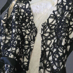Black lace fabric with a white background
