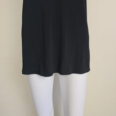 Black mini dress on a light background