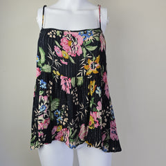 Black floral-patterned top on a light background