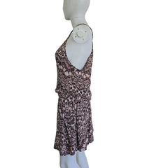 Patterned dress on a mannequin against a plain background