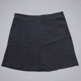 Black skirt on a tiled floor