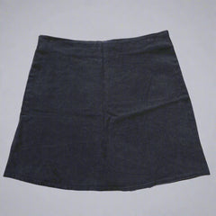 Black skirt on a tiled floor