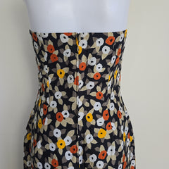 Floral-patterned strapless dress on a light background