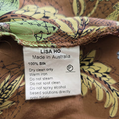 Fabric with a label indicating 'Made in Australia' and product details on a patterned background.