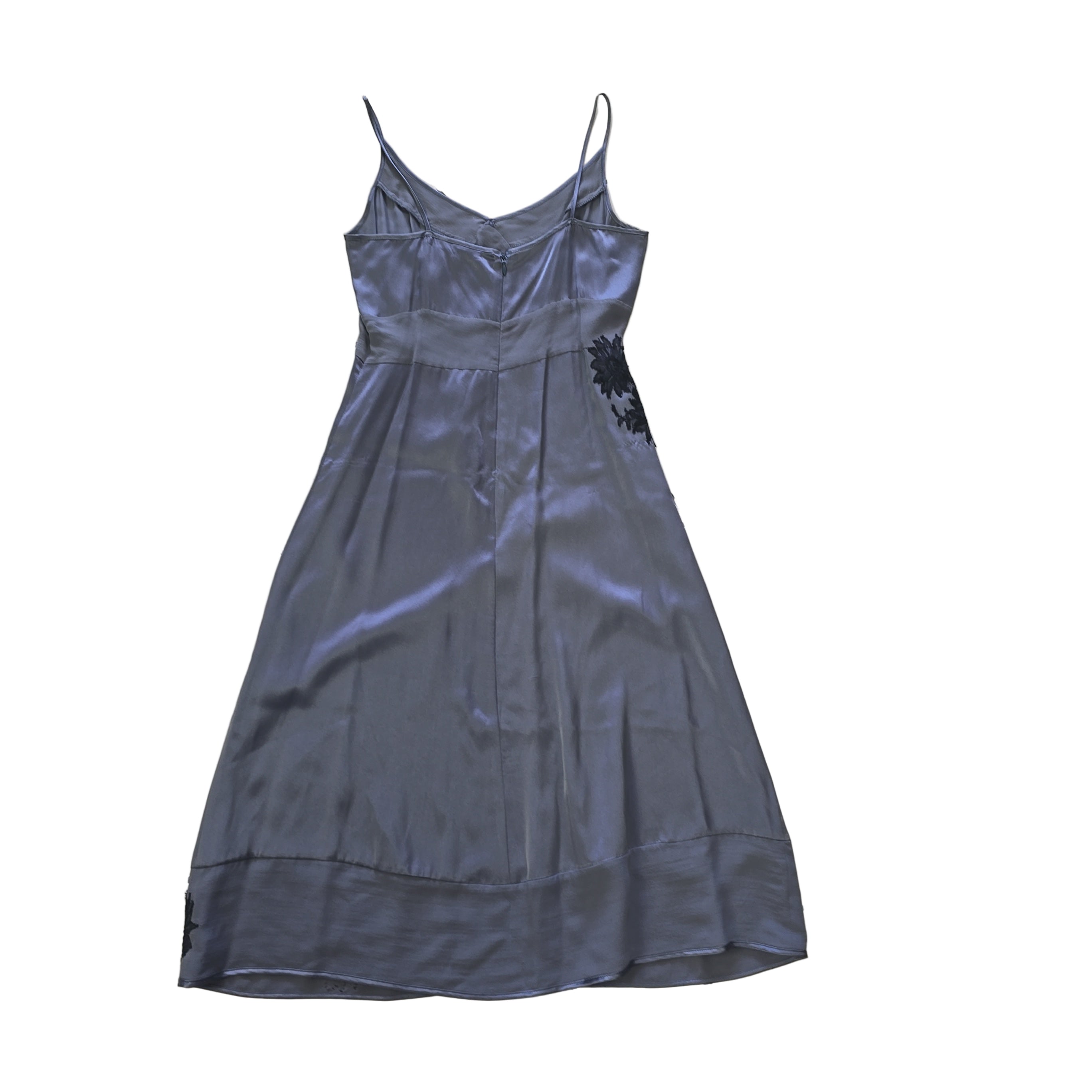 Grey dress with black floral patterns on a light background.