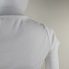 Close-up of a textured white fabric on a neutral background