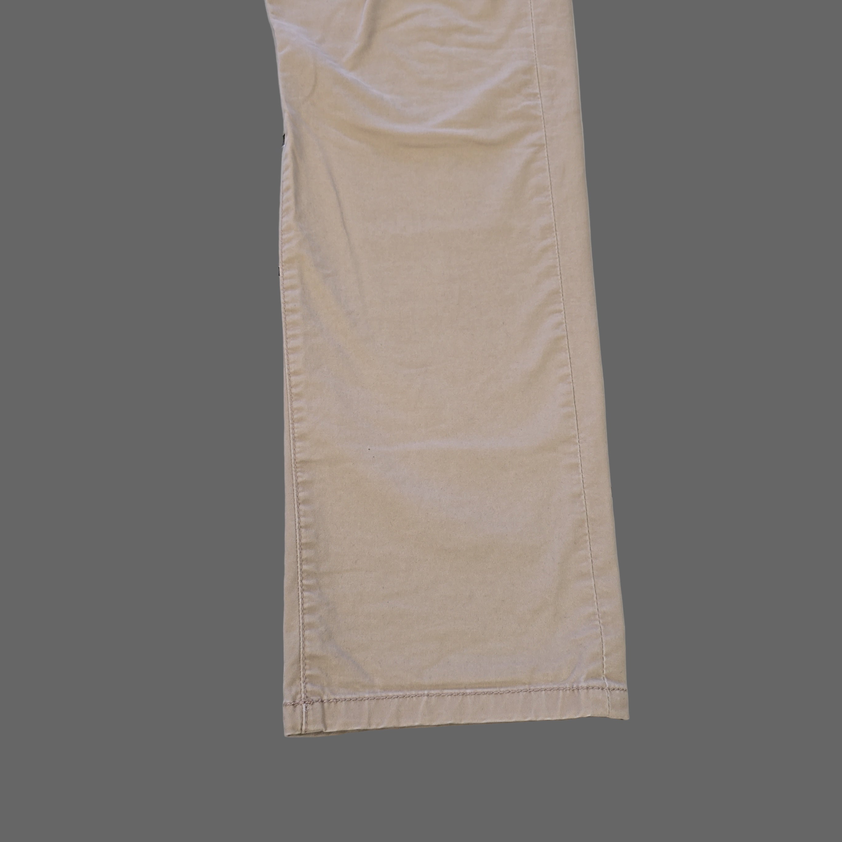 Beige pants on a tiled floor