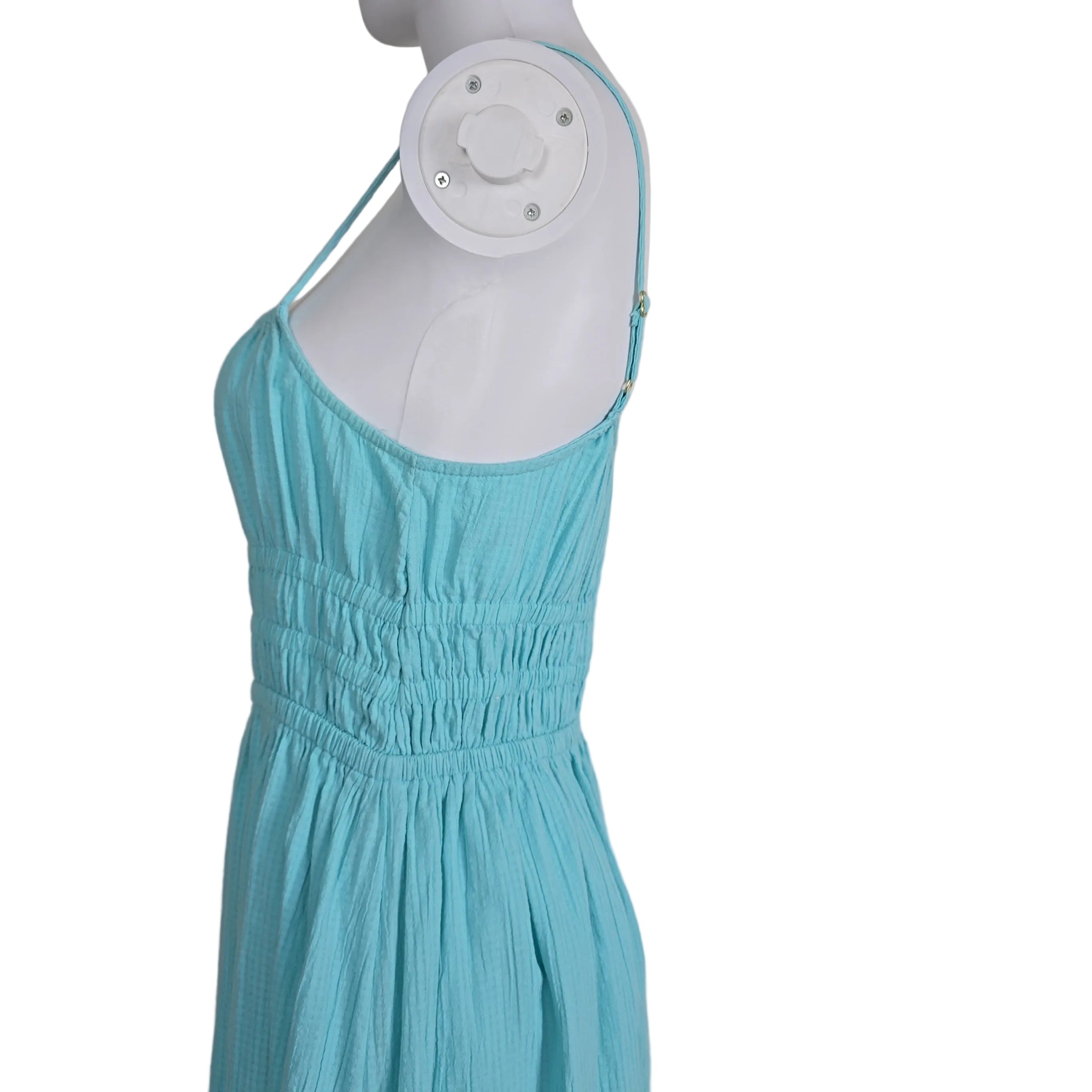 Mannequin wearing a turquoise dress