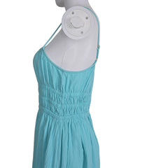 Mannequin wearing a turquoise dress