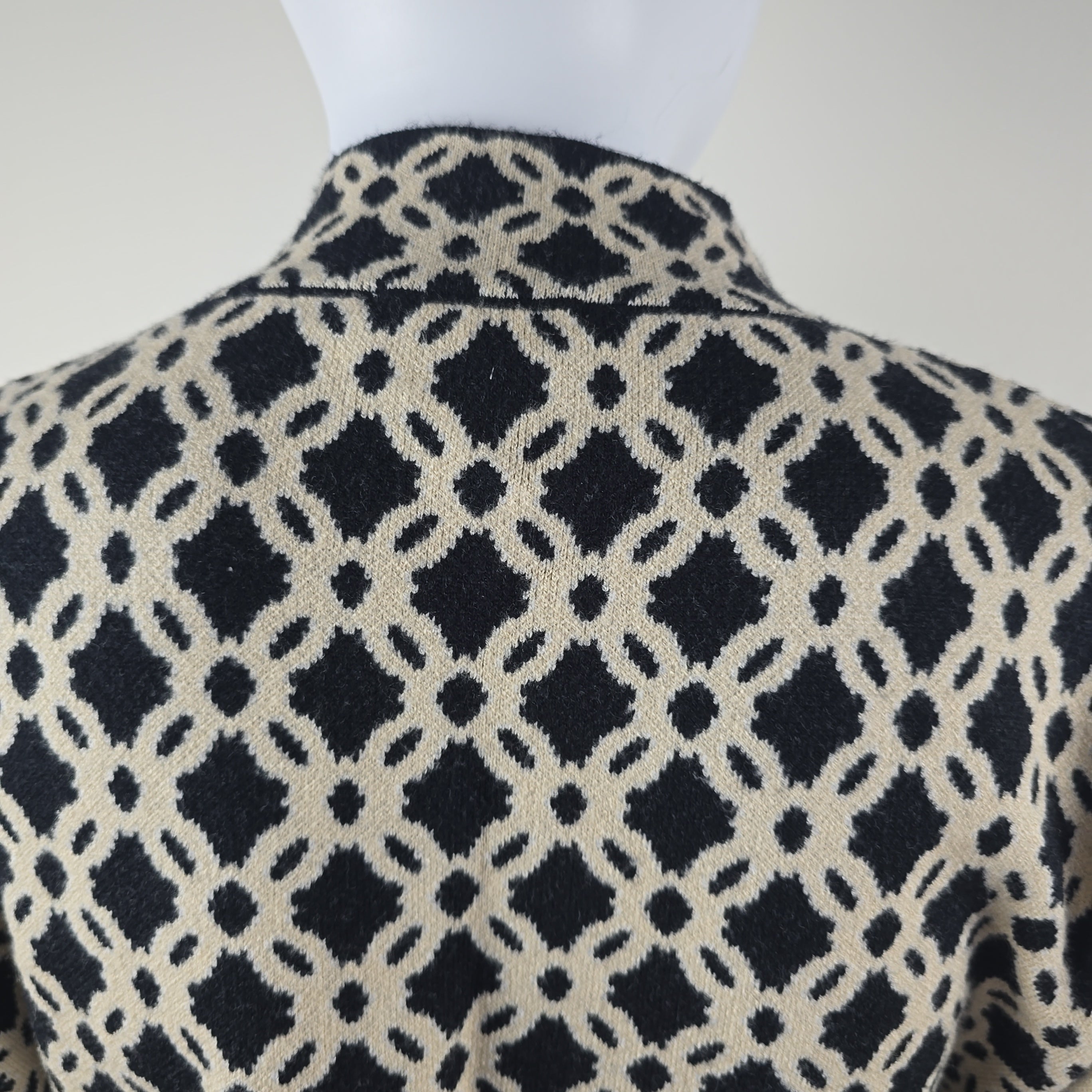 Close-up of fabric with black geometric pattern on a white background