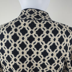 Close-up of fabric with black geometric pattern on a white background