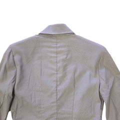 Light gray jacket on a white tiled floor