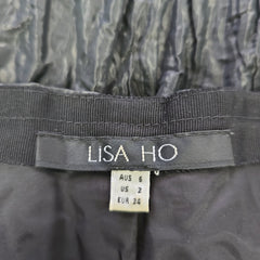 Label with 'LISA HO' branding on a textured fabric background