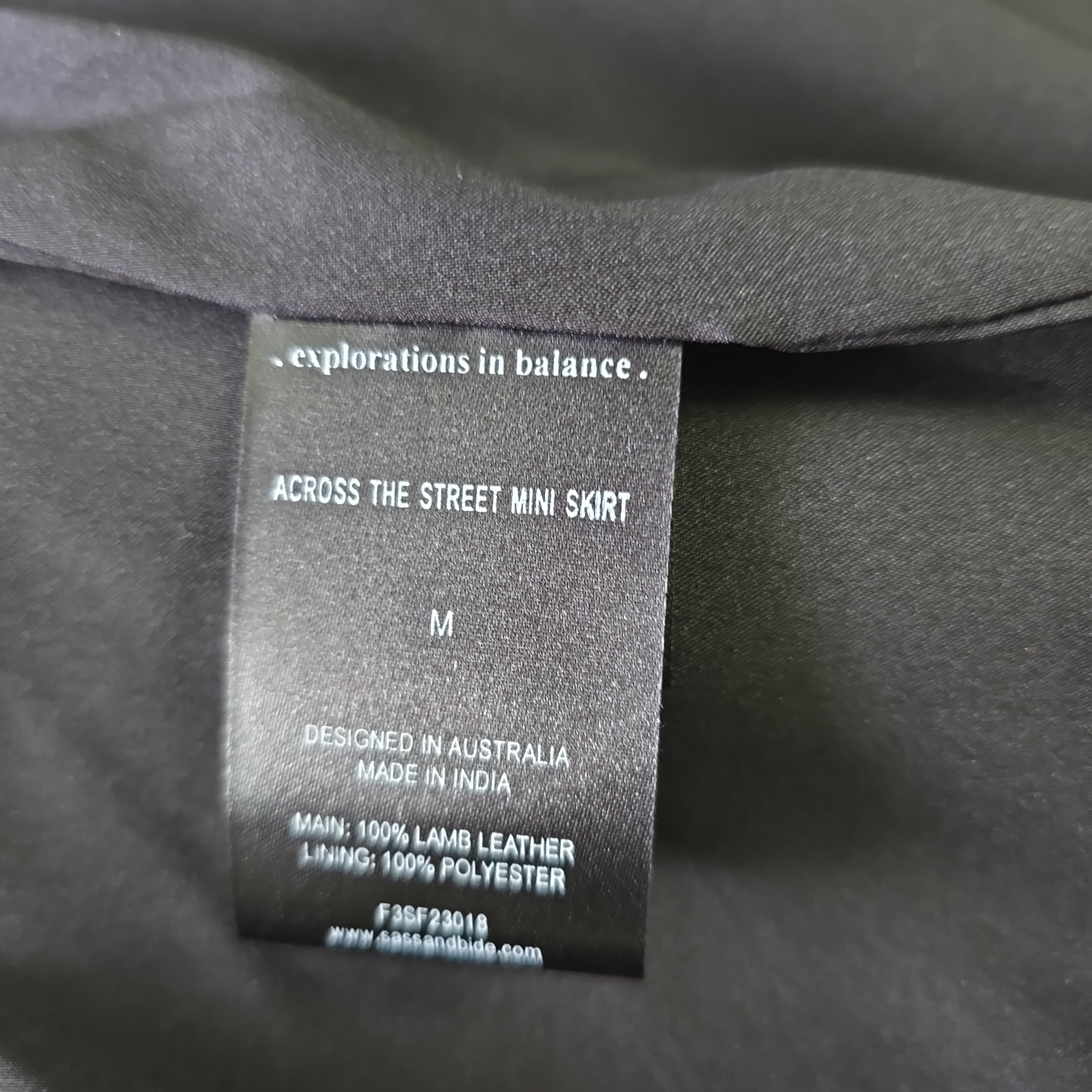 Clothing label on a dark fabric background