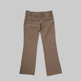 Brown pants on a white tiled floor