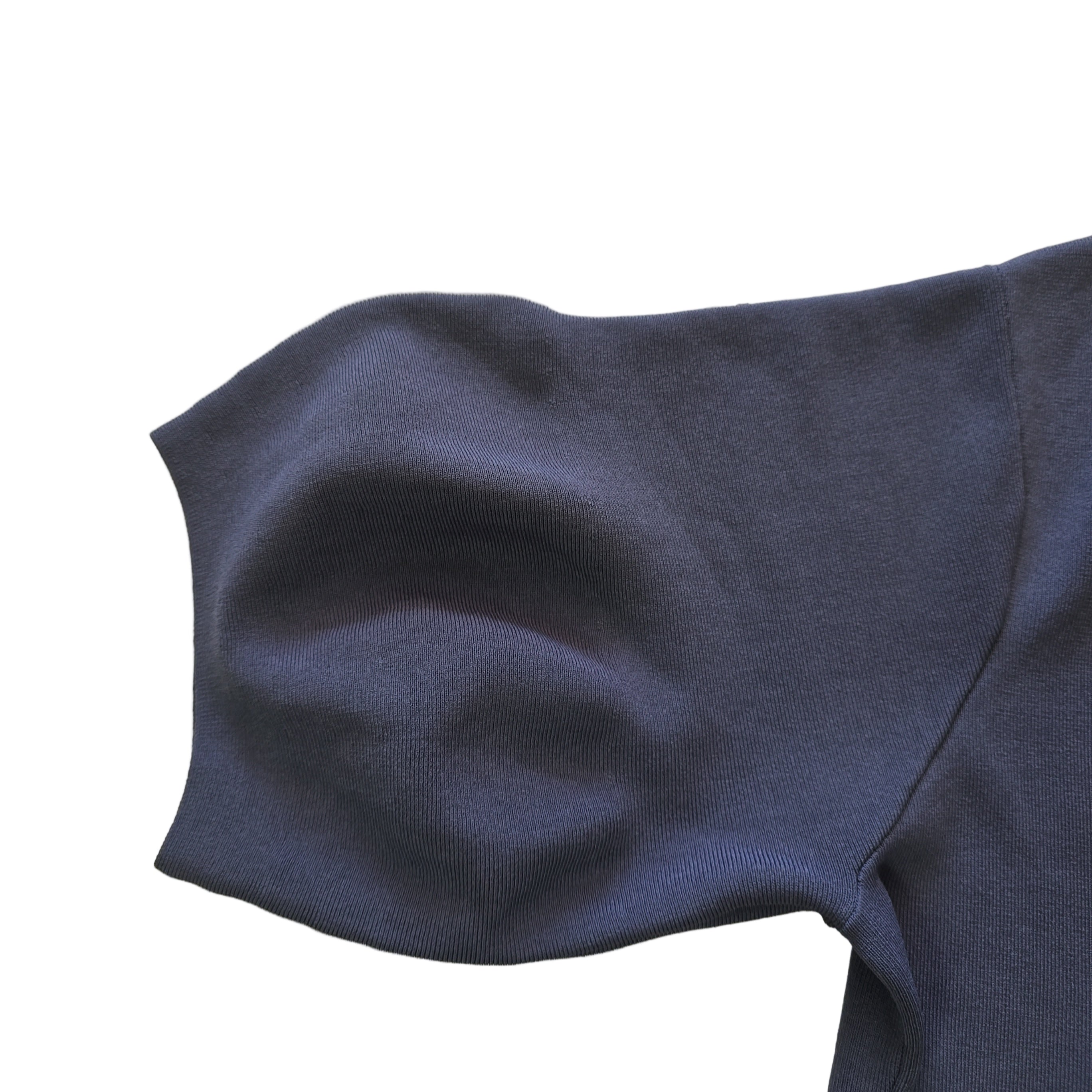 Dark blue fabric on a beige tiled floor