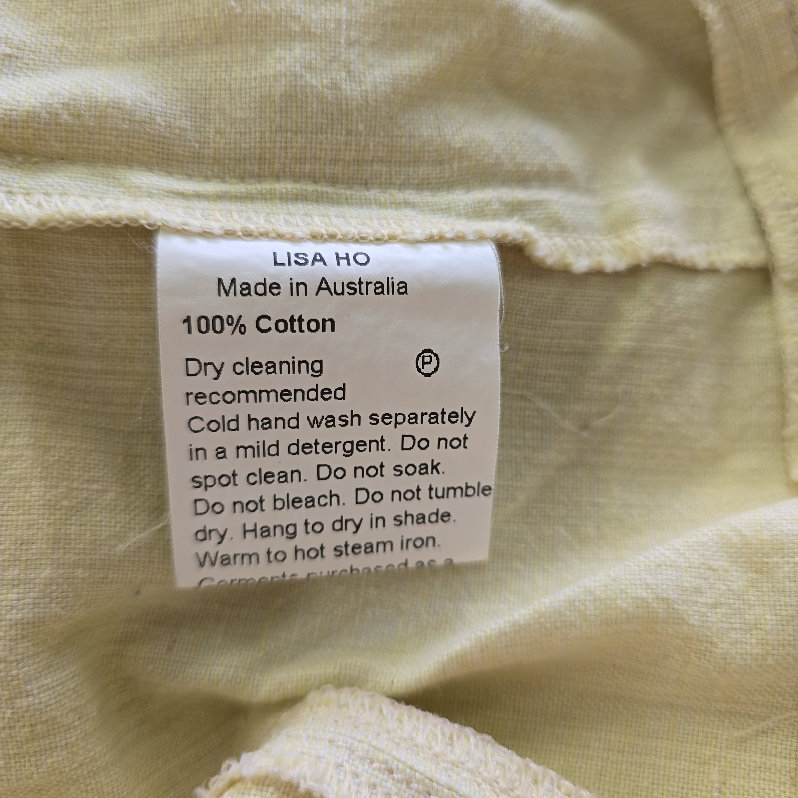 Clothing label on a beige fabric background