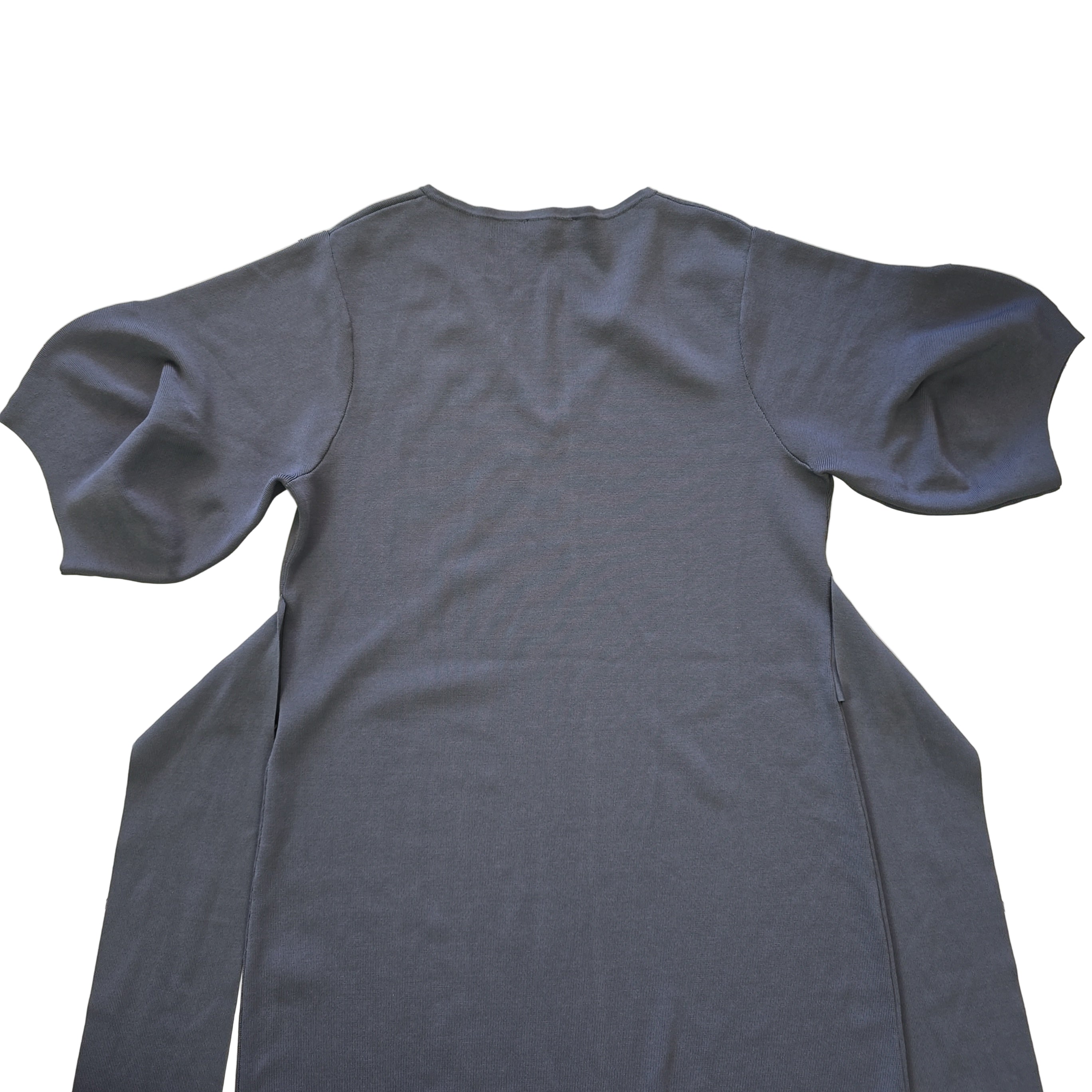 Navy dress on a tiled floor