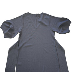 Navy dress on a tiled floor