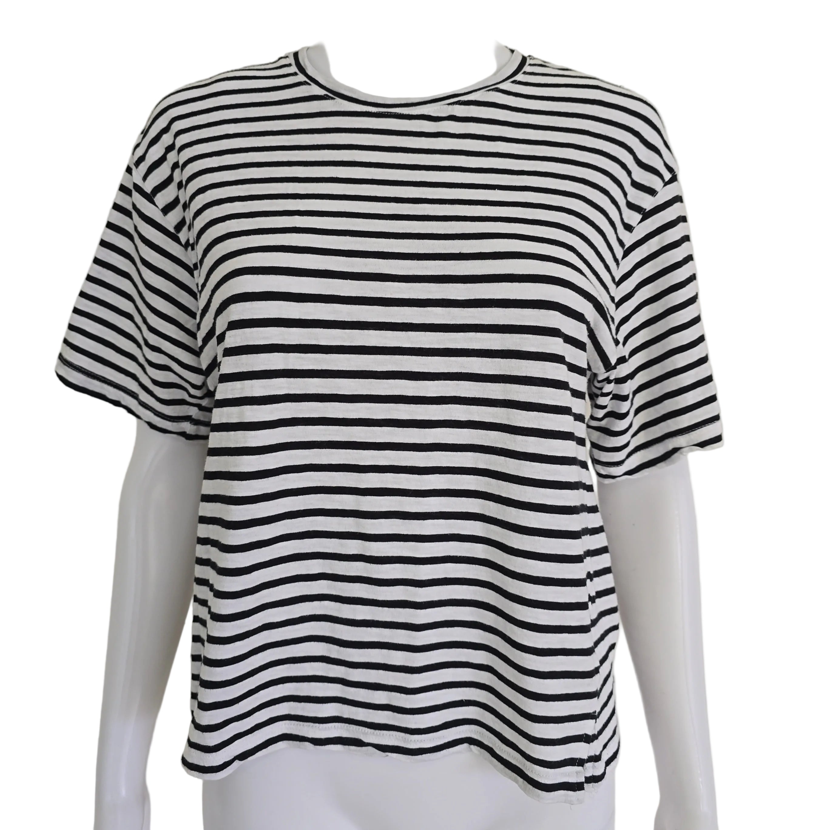 Black and white striped top on a mannequin against a beige background