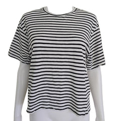 Black and white striped top on a mannequin against a beige background
