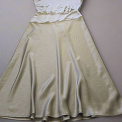 Olive dress on a tiled floor