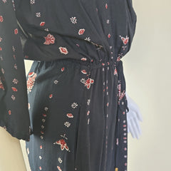 Black dress with floral patterns on a white background