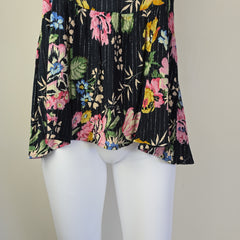 Black floral-patterned top on a light background