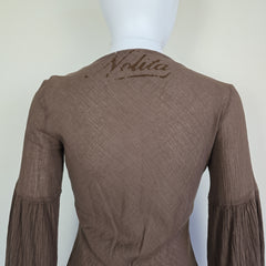 Brown fabric with 'Nolita' branding on a white background