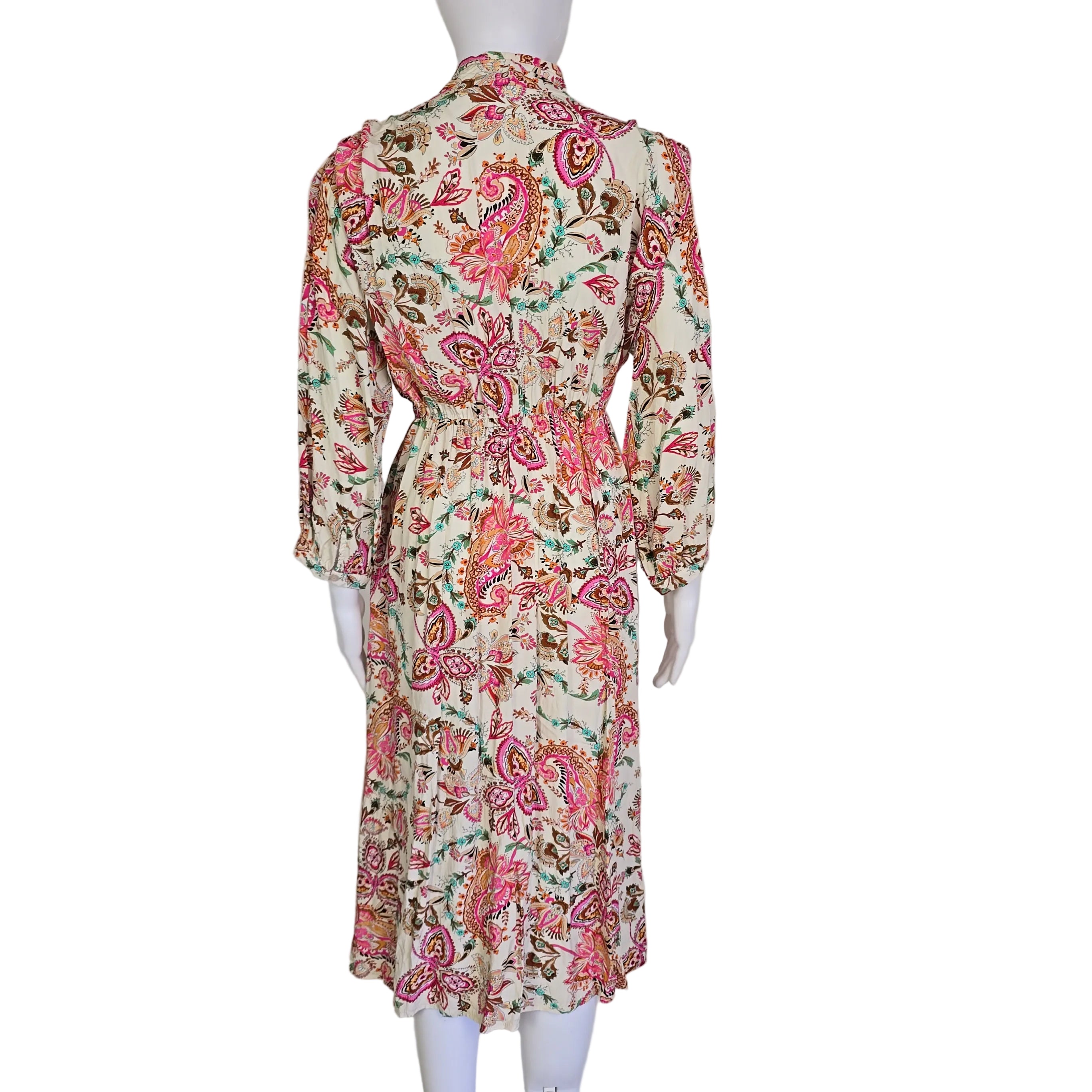 Floral patterned wrap style dress on a light background