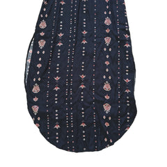 Black dress with white and pink patterns on a light background