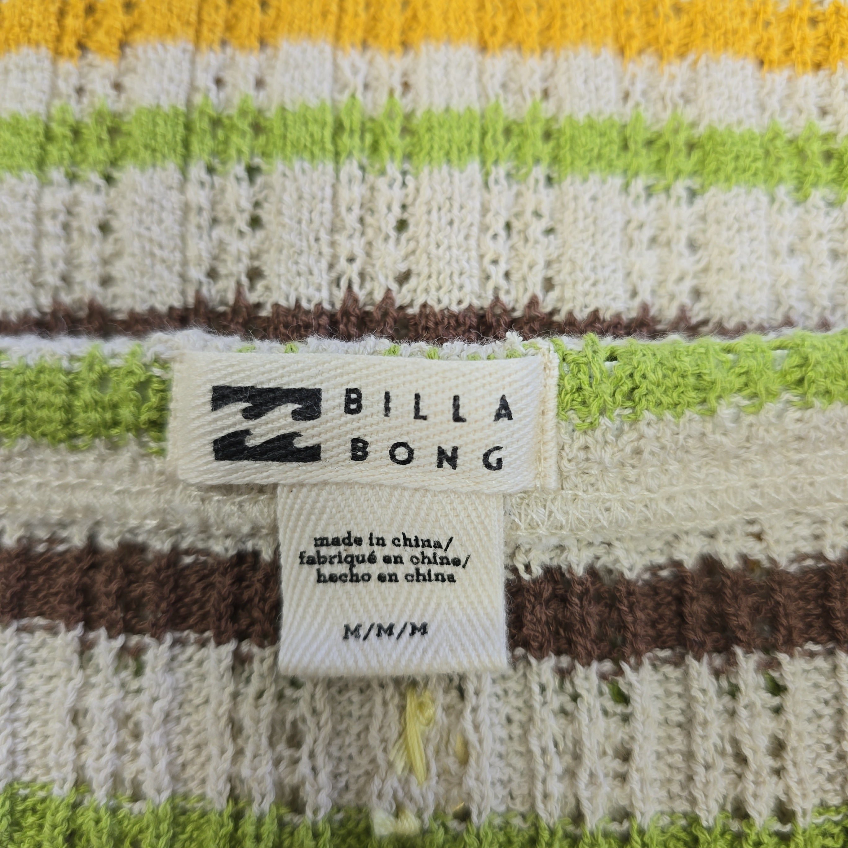 Close-up of a Billabong label on a striped fabric background
