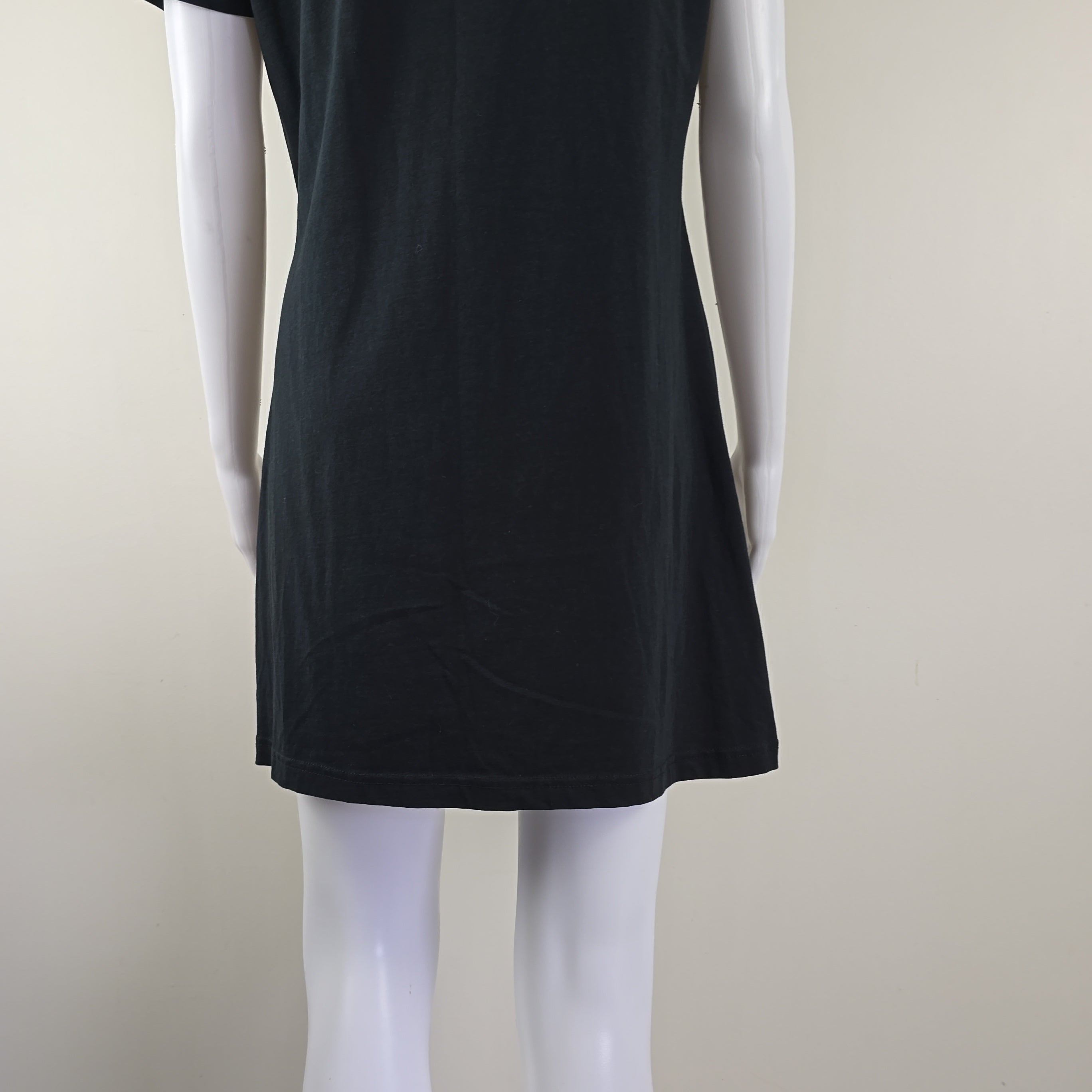 Black t-shirt dress with DKNY logo on a light background