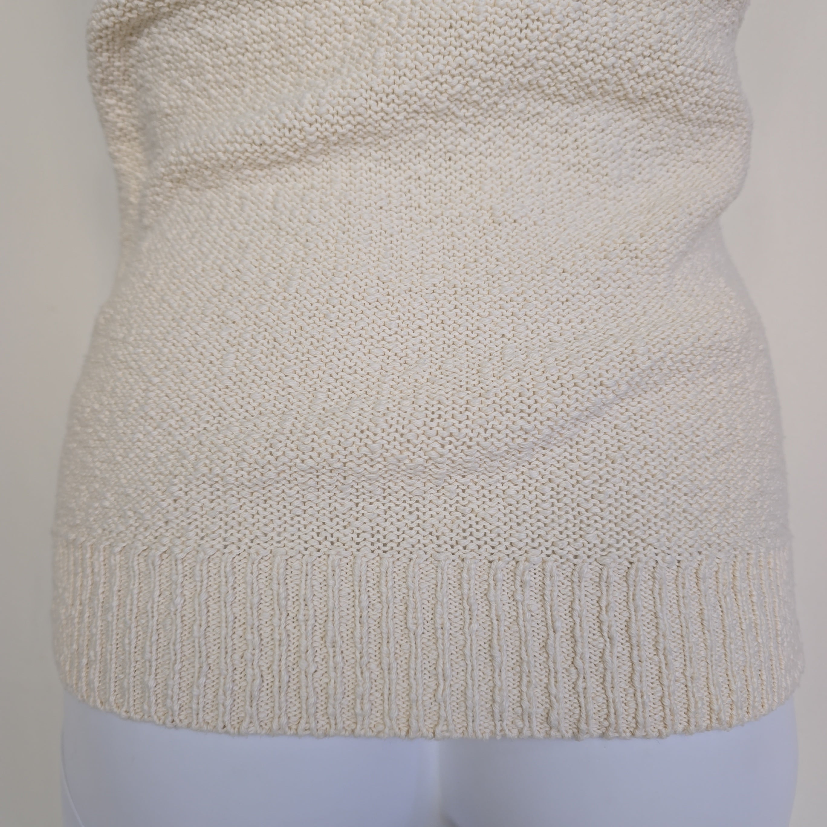 White knitted tank top on a light background