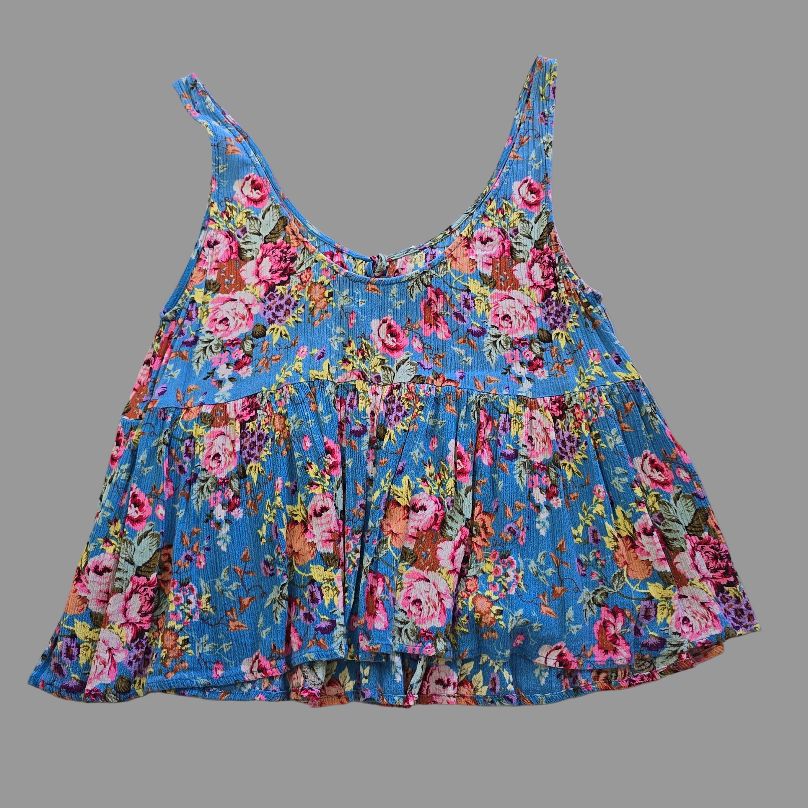 Blue floral top with on a light background