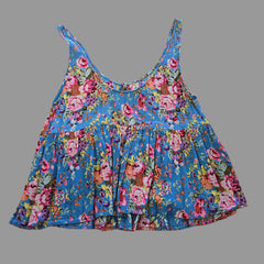 Blue floral top with on a light background