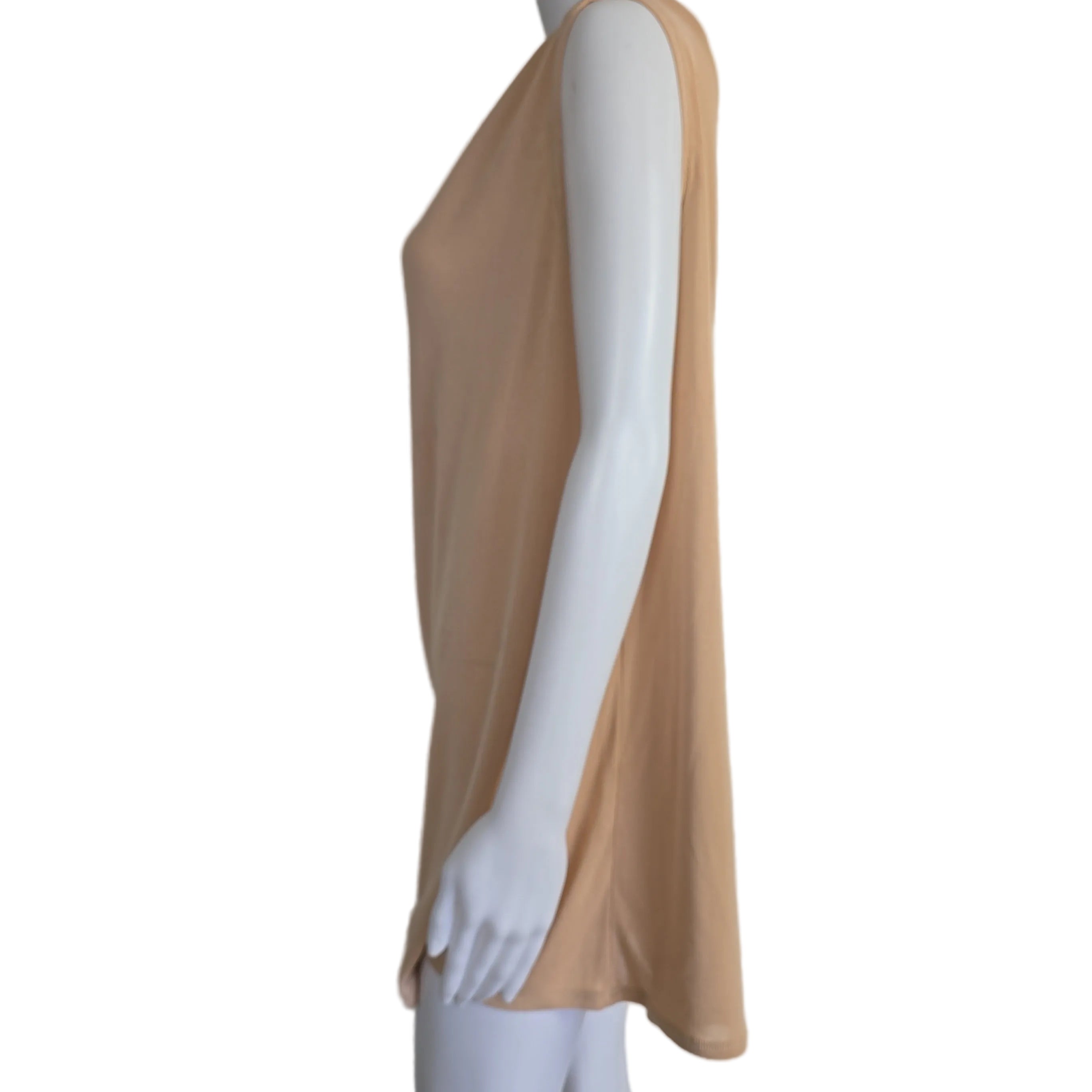 Mannequin wearing a beige top on a plain background