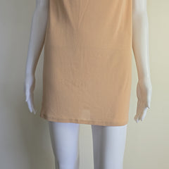 Mannequin wearing a beige top on a plain background
