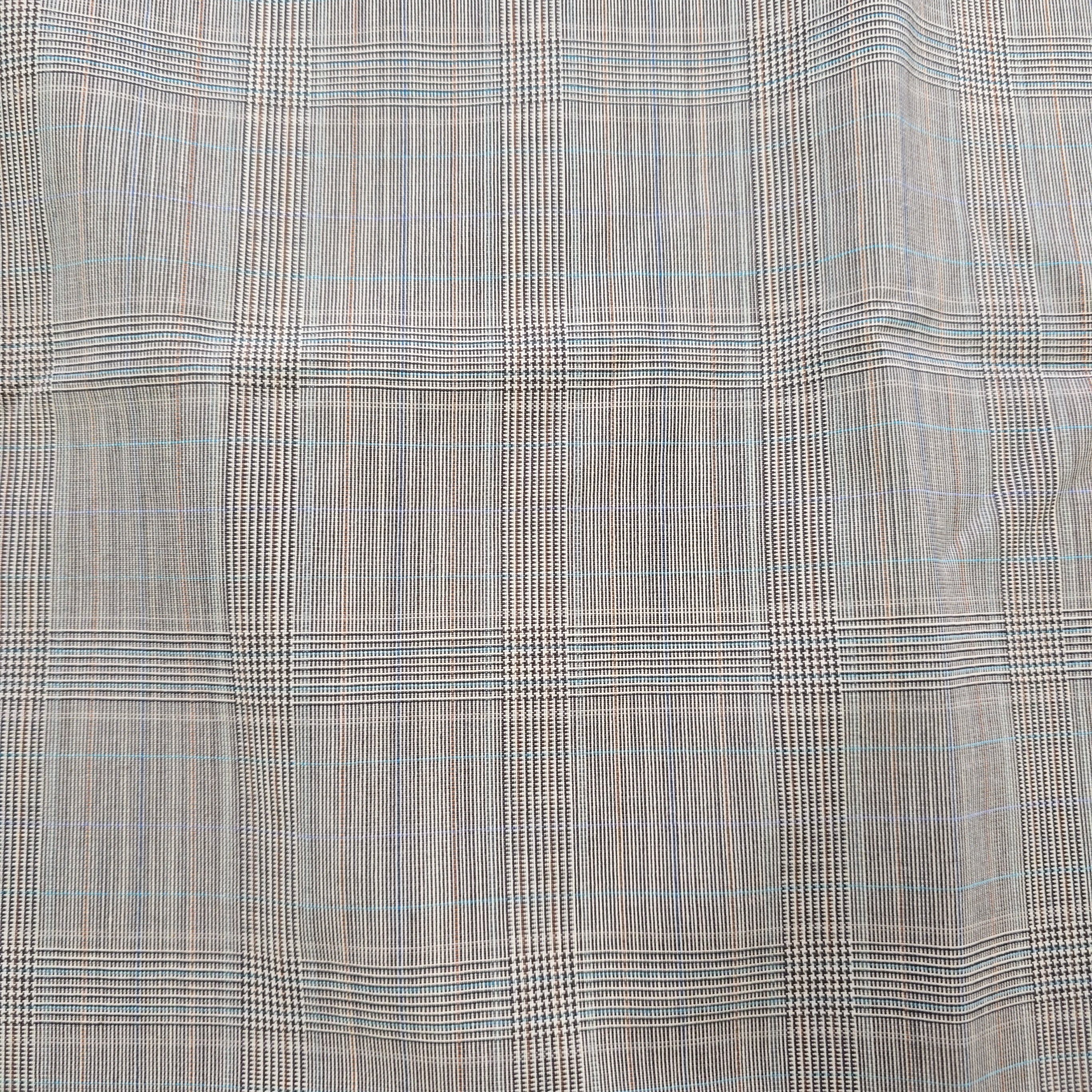 Textured fabric with a checkered pattern in gray and black.